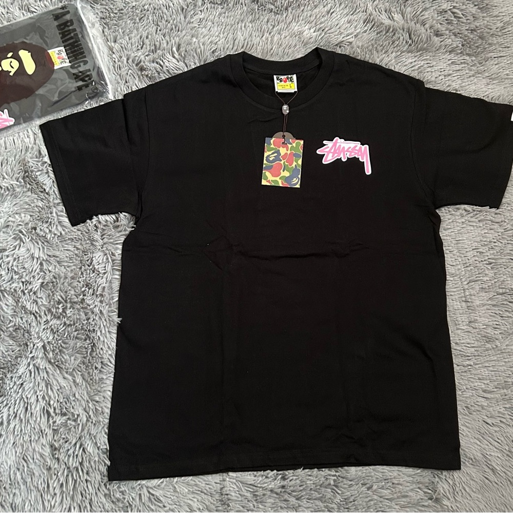 Stussy Black Tee with Vibrant Pink Logo